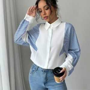 تألقي بأسلوب لا يُضاهى: بلوزة الأناقة المخططة بأزرار ساحرة