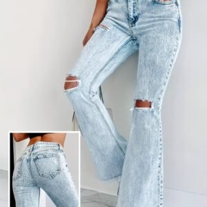 جينز واسع الساق الممزق: أناقة عتيقة بلمسة عصرية.