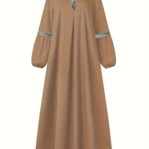 عباءة الأناقة الذهبية: سحر المحتشمة في كل خطوة