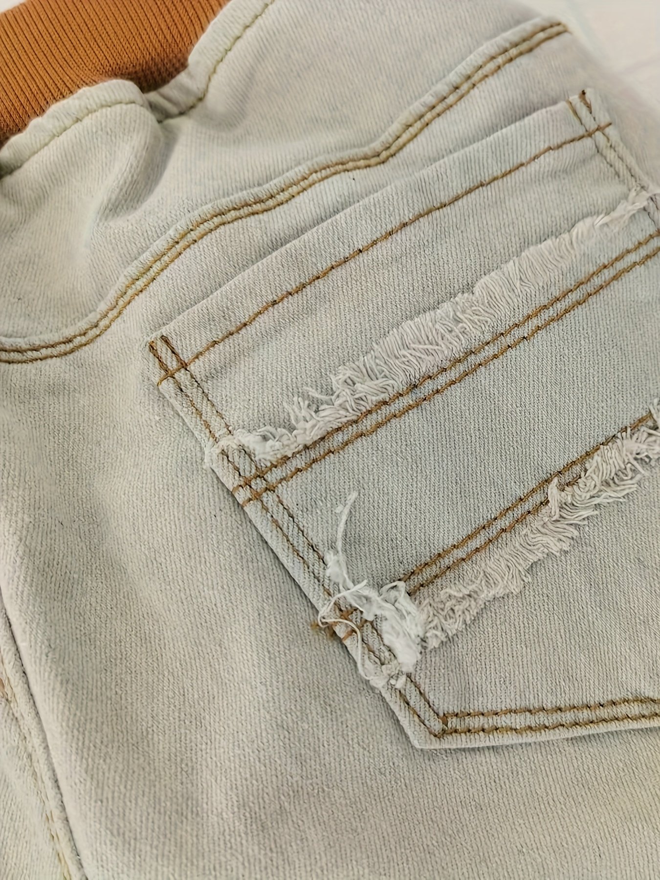 ג'ינס ילדים אופנתי: נגיעת רחוב נועזת ונוחות מירבית! – תמונה 9