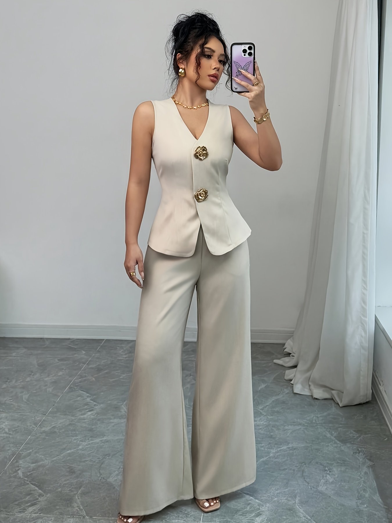 طقم الأناقة العصرية: فيست بياقة V وبنطال واسع الساقين