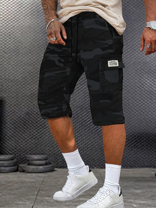 A Pair of Mid to Long Casual Pants with a Camouflage Pattern, Featuring Large Pockets And Patched Pockets with Tags. The Waist Has a Drawstring Design. - Image 2